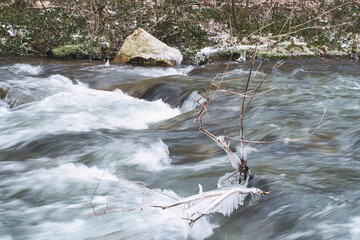 Picnic area of frozen Grza waterfall and lake - beauty of winter nature of Serbia
