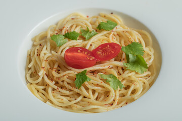 Delicious spaghetti with greens and cherry tomato