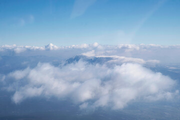 Obraz premium Snowy peak of Rtanj mountain in clouds 