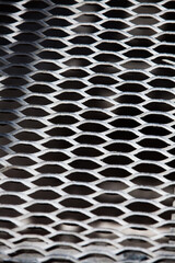 Steel grid floor on factory. Close-up of grid's pattern.