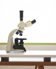 Laboratory with miscroscope on workbench on a white background