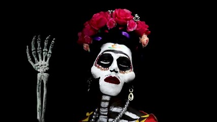 Frida Kahlo skull make up for the day of the dead in mexico. Model with body paint and costume.