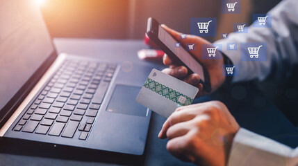 Businessman do online shopping with credit card and mobile phone. Digital shopping concept.