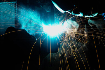 Industrial workers at the welded steel factory