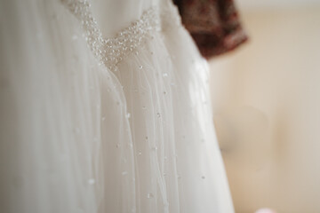 photo of a bride's wedding dress details