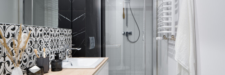 Functional and trendy bathroom with shower, panorama