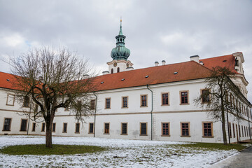 Baroque white benedictine monastery Brevnov with church, Medieval Basilica of St. Marquette, Garden...