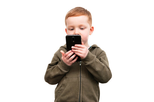 Little serious red hair child with smartphone isolated on white