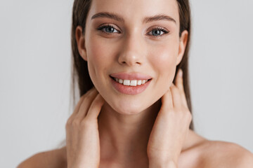 Happy shirtless girl smiling and looking at camera
