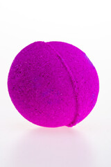 Purple salt bath ball on a white background. 
