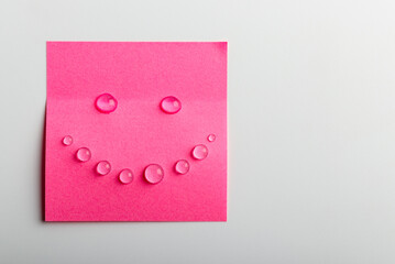 Pink sticky note. Happy and smile concept.