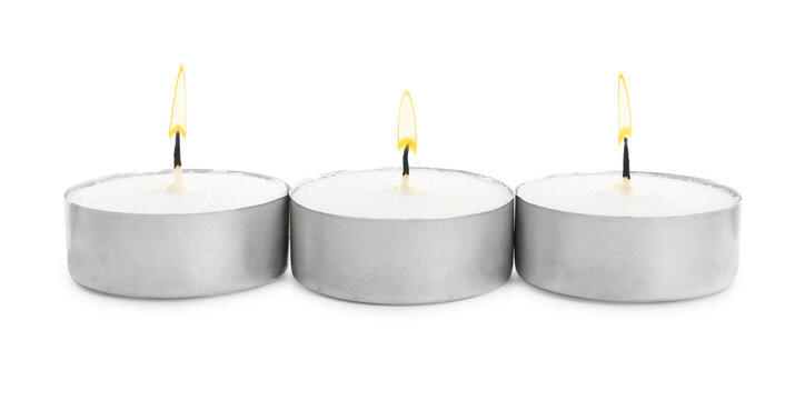 Wax candles on white background. Interior elements