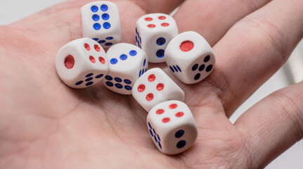 White game cubics in hand. Concept of luck, chance and leisure fun.