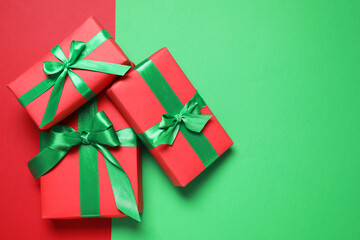 Gift boxes on color background, flat lay. Space for text