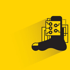 robotic foot embed with microchip with shadow on yellow background