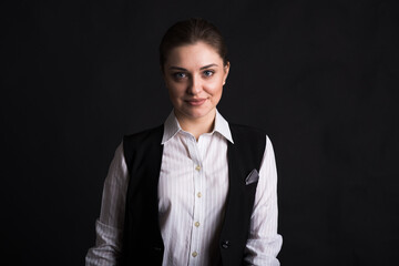 Portrait of a female business lady in the studio on a black background