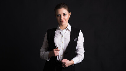 Portrait of a female business lady in the studio on a black background
