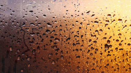 Drops condensation on the clear glass window. Water drops. Abstract background texture, condensation on the glass with dripping drops