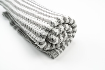 Gray white towel with stripes, on an isolated white background