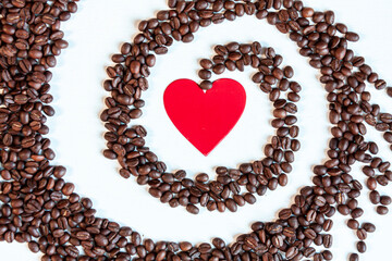 a red heart surrounded by a spiral of coffee beans