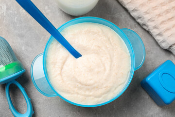 Flat lay composition with healthy baby food on grey table