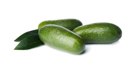 Fresh whole seedless avocados with leaves isolated on white