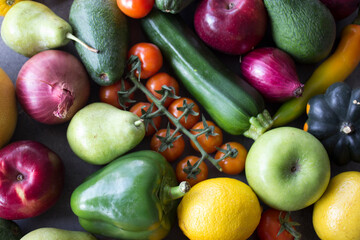 Fresh organic fruits and vegetables on a table. Healthy eating concept. Vegetarian meal ingredients top view photo. 