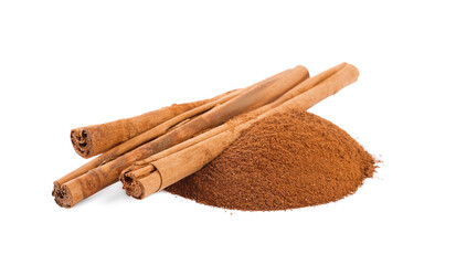 Aromatic cinnamon sticks and powder on white background