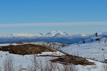 Fototapeta na wymiar Scenic mountain range covered in snow in northern Norway