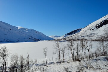 Fototapeta na wymiar Frozen lake on Kaperdalen, Norway