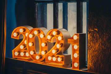 New Year 2021 Creative Design Concept numbers from yellow bulbs