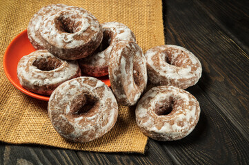 Homemade round gingerbread cookies with icing in a plate. Idea for a delicious breakfast or dinner. Top view