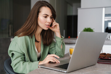 Attractive young woman working on laptop