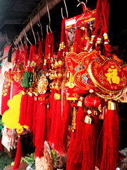 Vertical shot of the Chinese New year decorations for sale in a rural market