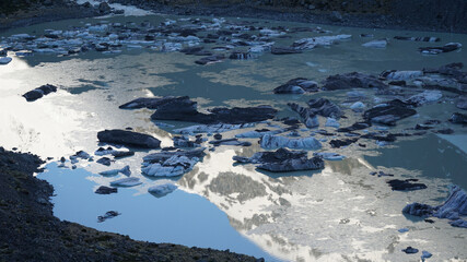 Ice on Hooker lake with Hooker Glacier and Mountains in the Background at Aoraki / Mount Cook in...
