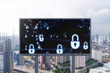 Padlock icon hologram on road billboard over panorama city view of Kuala Lumpur at day time to protect business, Malaysia, Asia. The concept of information security shields.