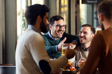 Group of happy friends in a bar