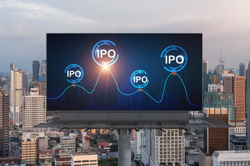 IPO icon hologram on road billboard over sunset panorama city view of Kuala Lumpur. KL is the hub...