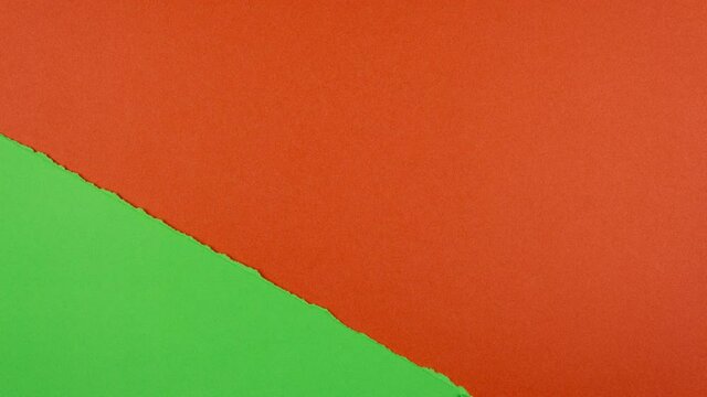 Stop motion animation. Green paper tear and reveal red background. Space for text