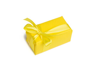 rectangular box with a gift wrapped in yellow paper and tied with a silk yellow ribbon