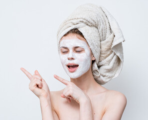 pretty woman with bare shoulders cream mask skin care cropped view