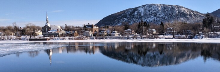 Naklejka premium Reflection of Mont St Hilaire on Richelieu River