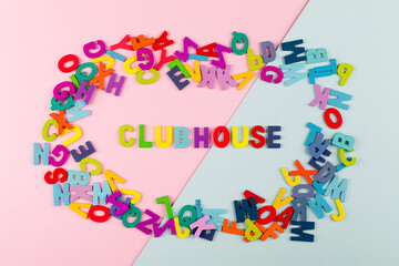 Bright letters Clubhouse. New trend. Social application on on the smartphone. Flat lay