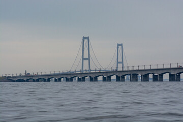 Big Belt bridge in denmark on a cloudy grey day.