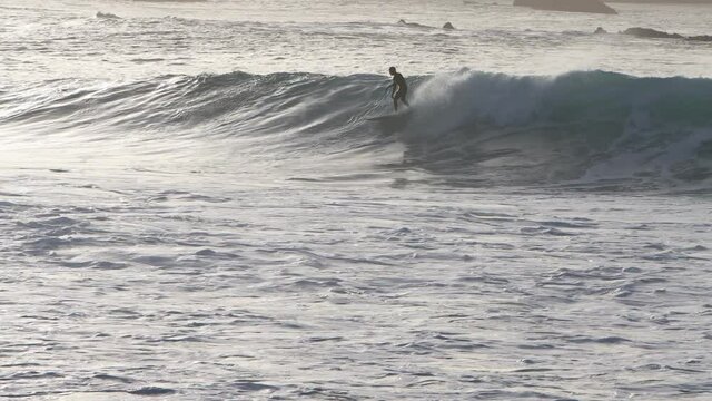 Surfer in Gran Canaria island beach el rincon on back light