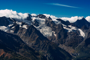 Mountain glacier. Stunning views of the mountain. Grand view over steep slopes on a sunny winter day. Mountain peak. Copy space