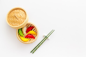 Asian steamed dumplings in wooden steamer. Traditional Chinese dim sum set