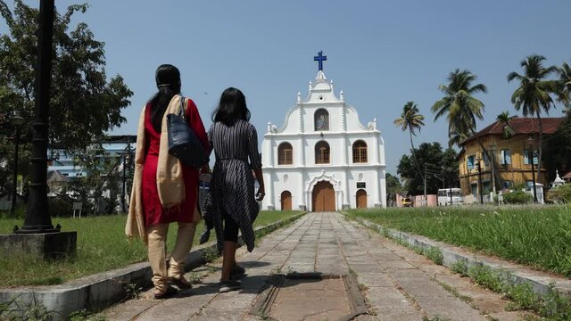 Old Christian catholic church in Fort Kochi , people  go prayer worship Sunday 4K slow motion video footage Cochin Kerala India. religion believers Jesus Christ visit pilgrim center Christmas Easter 