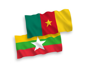 National vector fabric wave flags of Cameroon and Myanmar isolated on white background. 1 to 2 proportion.