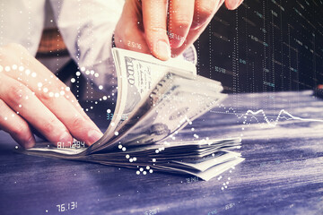 Double exposure of technology drawing hologram and us dollars bills and man hands. Data concept